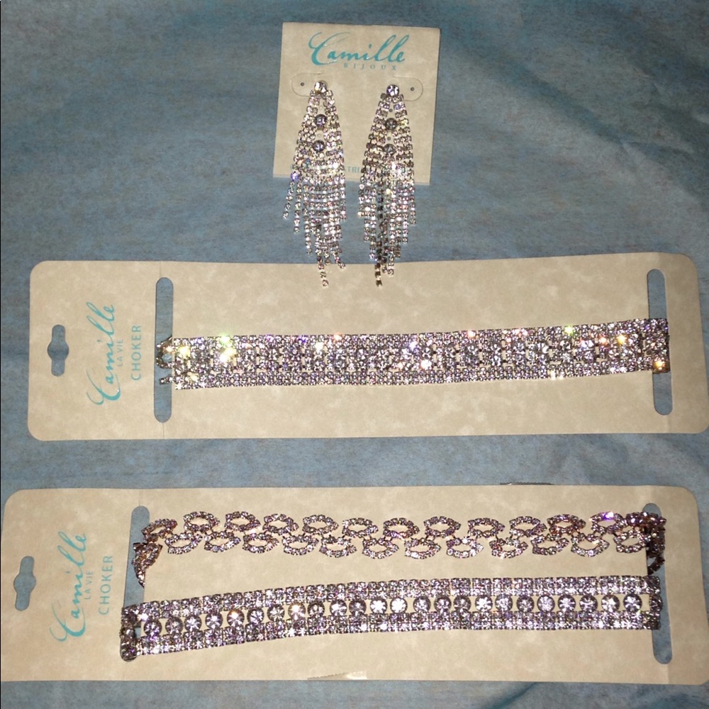 3 chokers and a pair of earrings.